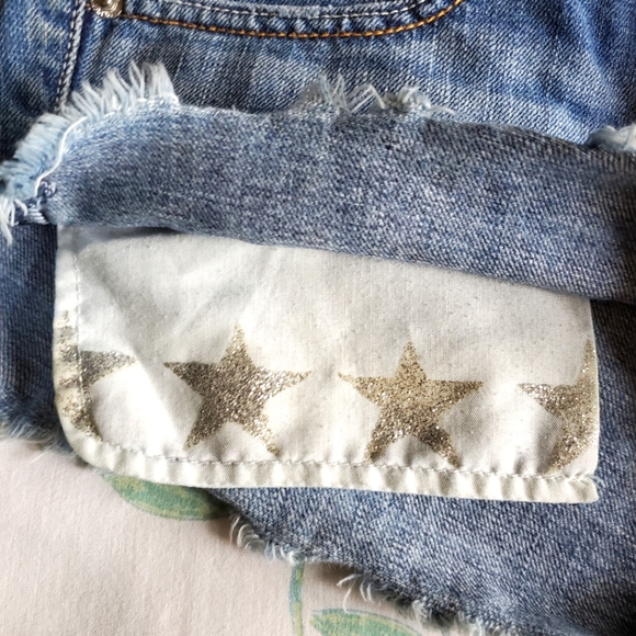 American Eagle High Waist Cut-Off Denim Shorts with Silver Glitter Star Pockets - Picture 4 of 9